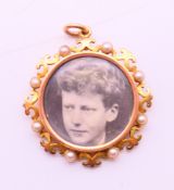 A 15 ct gold open picture locket pendant. 3.5 cm diameter. 9.5 grammes total weight.