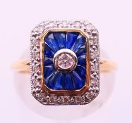 A 9 ct yellow gold Art Deco style diamond and sapphire ring.
