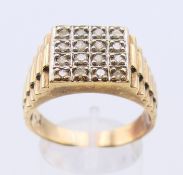 A 9 ct gold and diamond gentleman's ring. Ring size Y/Z. 8.9 grammes.