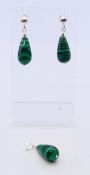 A pair of silver and malachite earrings and a matching pendant. Earrings 3.5 cm high, pendant 3.