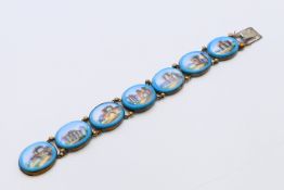 A Venetian-style bracelet with seven panels depicting various ruins. 18 cm long.