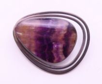 A silver and Blue John pendant/brooch. 4 cm high.