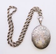A silver locket with bird and owl motif on a rope twist chain. Locket 5.