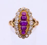 A gold ring set with five central rubies surrounded by diamonds. Ring size N/O.