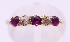 A gold, ruby and diamond ring. Ring size K.