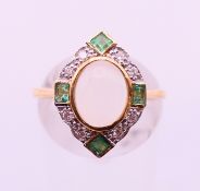 A 9 ct yellow gold Art Deco style diamond, emerald and cat's eye moonstone ring.