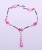 A silver and glass necklace. 48 cm long.