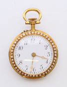 A gold and seed pearl pocket watch, numbered 81139. 2.75 cm diameter.