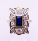 A platinum, diamond and sapphire ring. Ring size S.