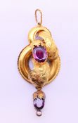 An unmarked 15 ct gold garnet and seed pearl drop pendant. 5 cm high excluding suspension loop. 3.