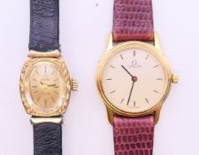 Two boxed Omega ladies' wristwatches. The largest 2.25 cm wide.