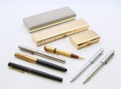 A collection of pens (including Sheaffer, Parker and Waterman), penknives and a Boson's whistle.