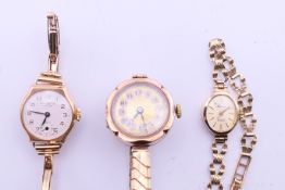 Three ladies' 9 ct gold-cased wristwatches (one with gold strap). The largest 2.75 cm wide. 44.