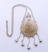 A Chinese jade and white metal snuff bottle on chain. The bottle 8.5 cm high.
