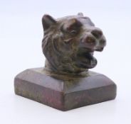 A Chinese bronze seal, the handle formed as a tiger. 3.5 cm high.