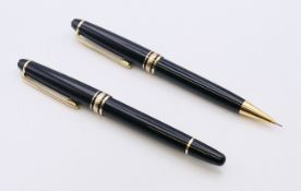 A boxed Mont Blanc (Montblanc) ball point pen and propelling pencil. The former 13.5 cm long.