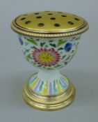 An early 19th century Chinese porcelain stem cup painted in bright enamels,