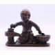 A bronze model of a boy cooking. 7 cm wide. - Image 1 of 4