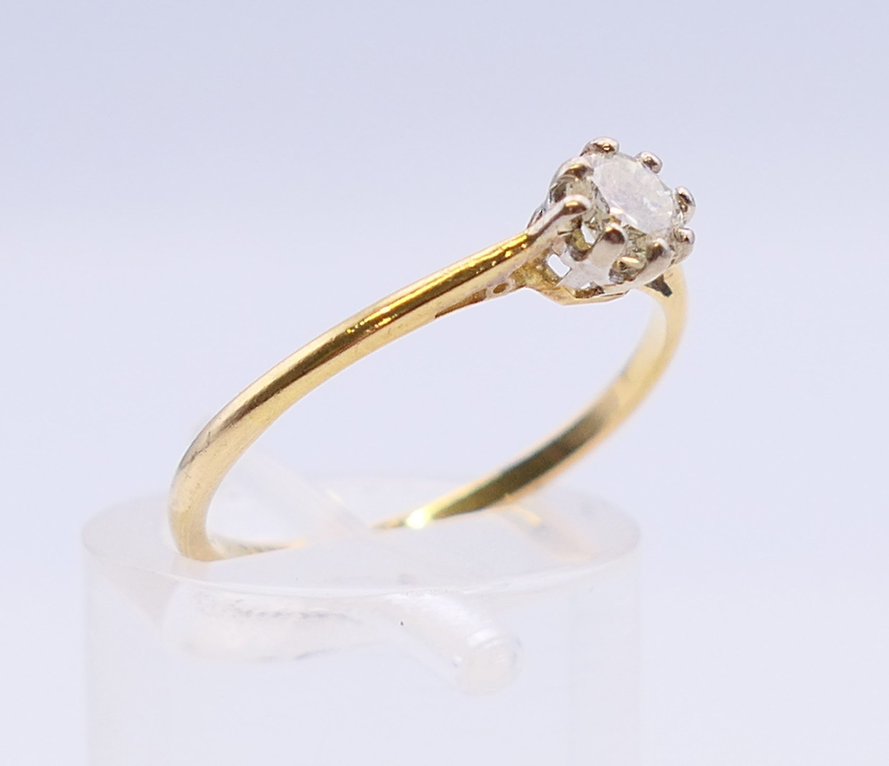 An 18 ct gold and platinum diamond solitaire ring. The claw set stone spreading to 0.25 carat. - Image 3 of 7