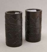 Two late 19th/early 20th century Chinese carved bamboo brush pots. Each 15.25 cm high.