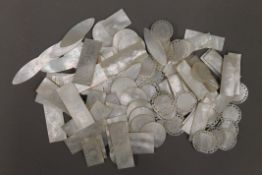 A large collection of 19th century Chinese mother-of-pearl gaming counters. The largest 5.5 cm long.