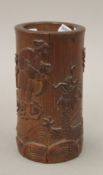A late 19th/early 20th century Chinese carved bamboo brush pot. 13.5 cm high.