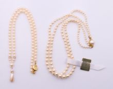 A two strand pearl necklace and a single strand pearl necklace. The latter 48 cm long.