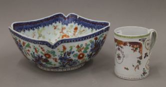 An 18th century Chinese Export tankard and a porcelain bowl. The former 12 cm high.