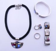 A suite of Michaela Frey (Freywille) enamel-decorated jewellery, comprising a bracelet,