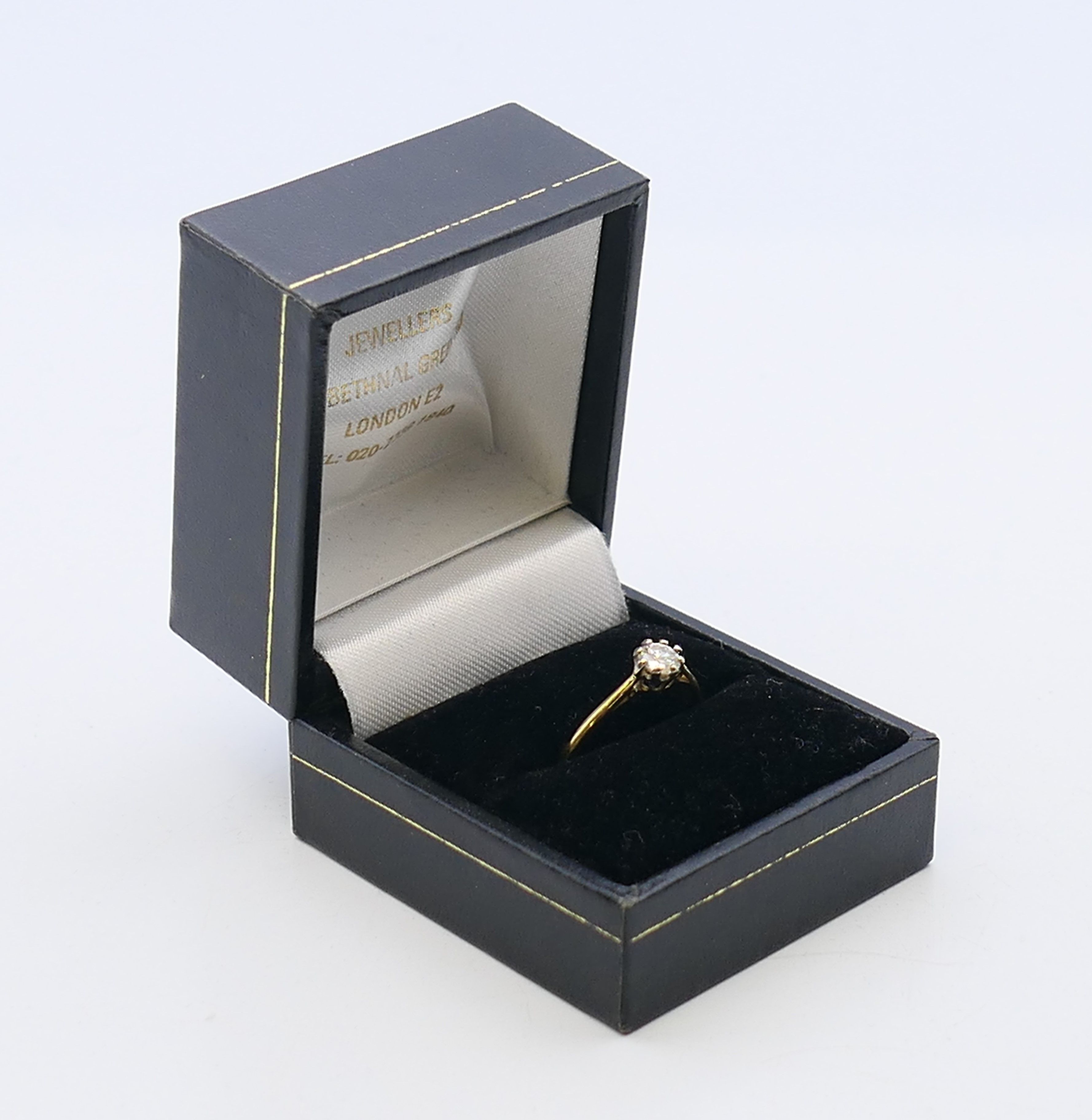 An 18 ct gold and platinum diamond solitaire ring. The claw set stone spreading to 0.25 carat. - Image 7 of 7