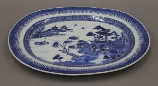 An 18th century Chinese porcelain blue and white finely painted oval dish. 37 cm wide.