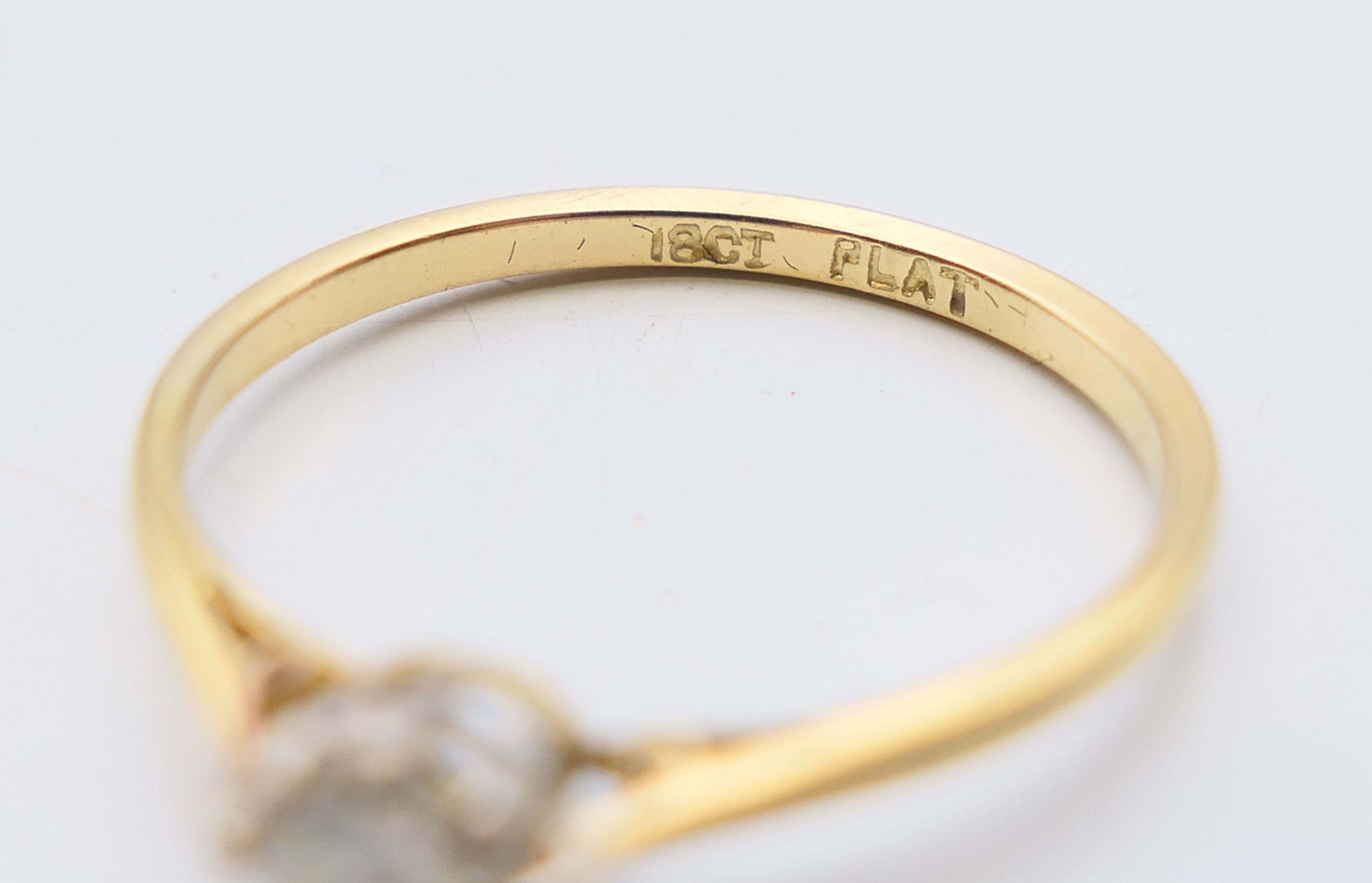 An 18 ct gold and platinum diamond solitaire ring. The claw set stone spreading to 0.25 carat. - Image 5 of 7