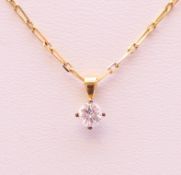 A diamond pendant (0.25 carat) on a gold, possibly 18 ct, chain. The chain 40 cm long.
