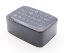 A 19th century Chinese papier mache seal box, the lid with calligraphy. 5.5 cm long.