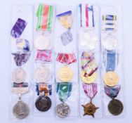 A collection of various medals, including some British military examples.