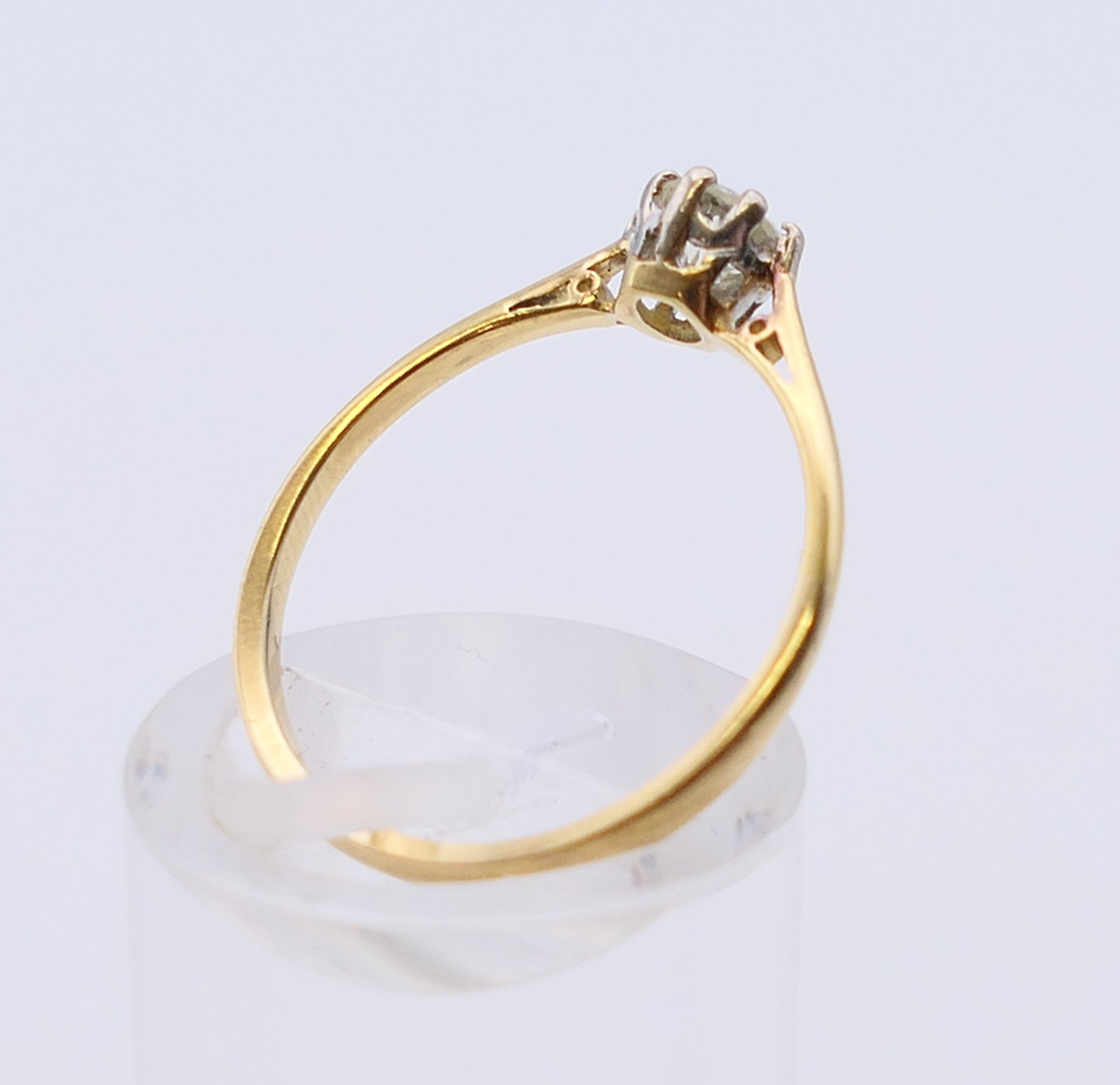 An 18 ct gold and platinum diamond solitaire ring. The claw set stone spreading to 0.25 carat. - Image 4 of 7