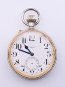 A silver-plated Goliath pocket watch in a silver-fronted case. The former 6.5 cm diameter.