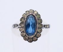 A 9 ct gold and silver dress ring. Ring size O.