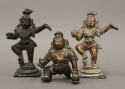 Three Indian bronze figures. The largest 8.5 cm high.