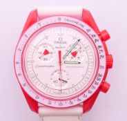 A boxed gentlemen's Omega X Swatch Speedmaster Mission to Mars MoonSwatch wristwatch. 4.25 cm wide.