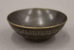 A small Chinese bronze bowl. 5.75 cm diameter.