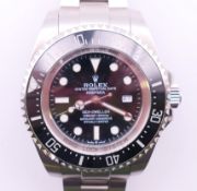 A boxed gentlemen's Rolex Oyster Perpetual Date Sea-Dweller wristwatch with some paperwork. 4.