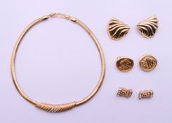 A Christian Dior necklace and three pairs of Christian Dior earrings. The necklace 38 cm long.