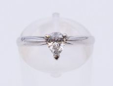 A platinum diamond solitaire ring. The claw set stone spreading to just under 0.5 carat.