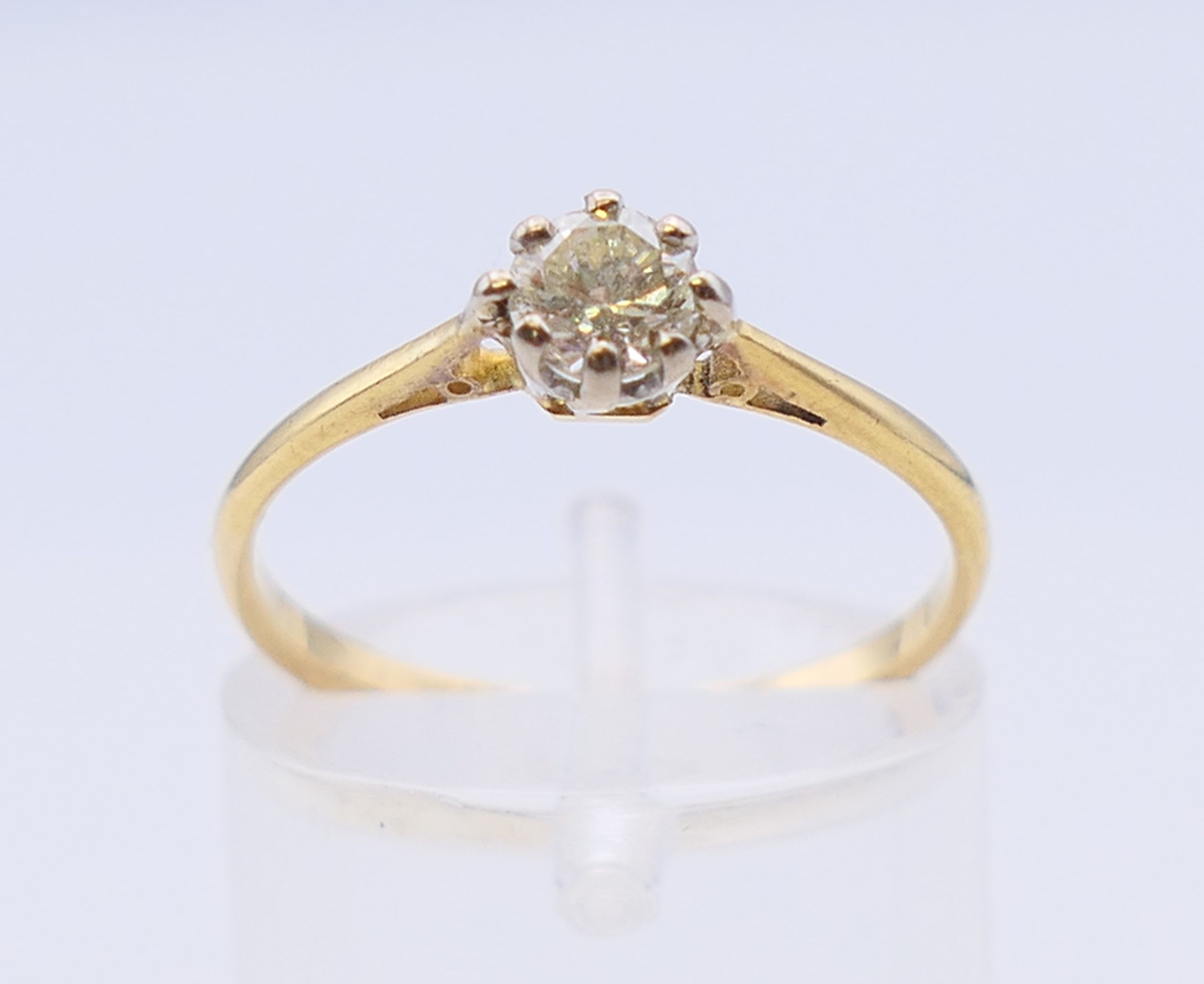 An 18 ct gold and platinum diamond solitaire ring. The claw set stone spreading to 0.25 carat. - Image 2 of 7