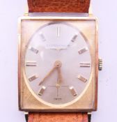 A boxed Longines 10 K gold filled wristwatch. 2.5 cm wide.