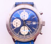 A gentleman's Breitling wristwatch with extra strap. 4.25 cm wide.