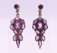 A pair of silver and amethyst earrings, each 5 cm high.