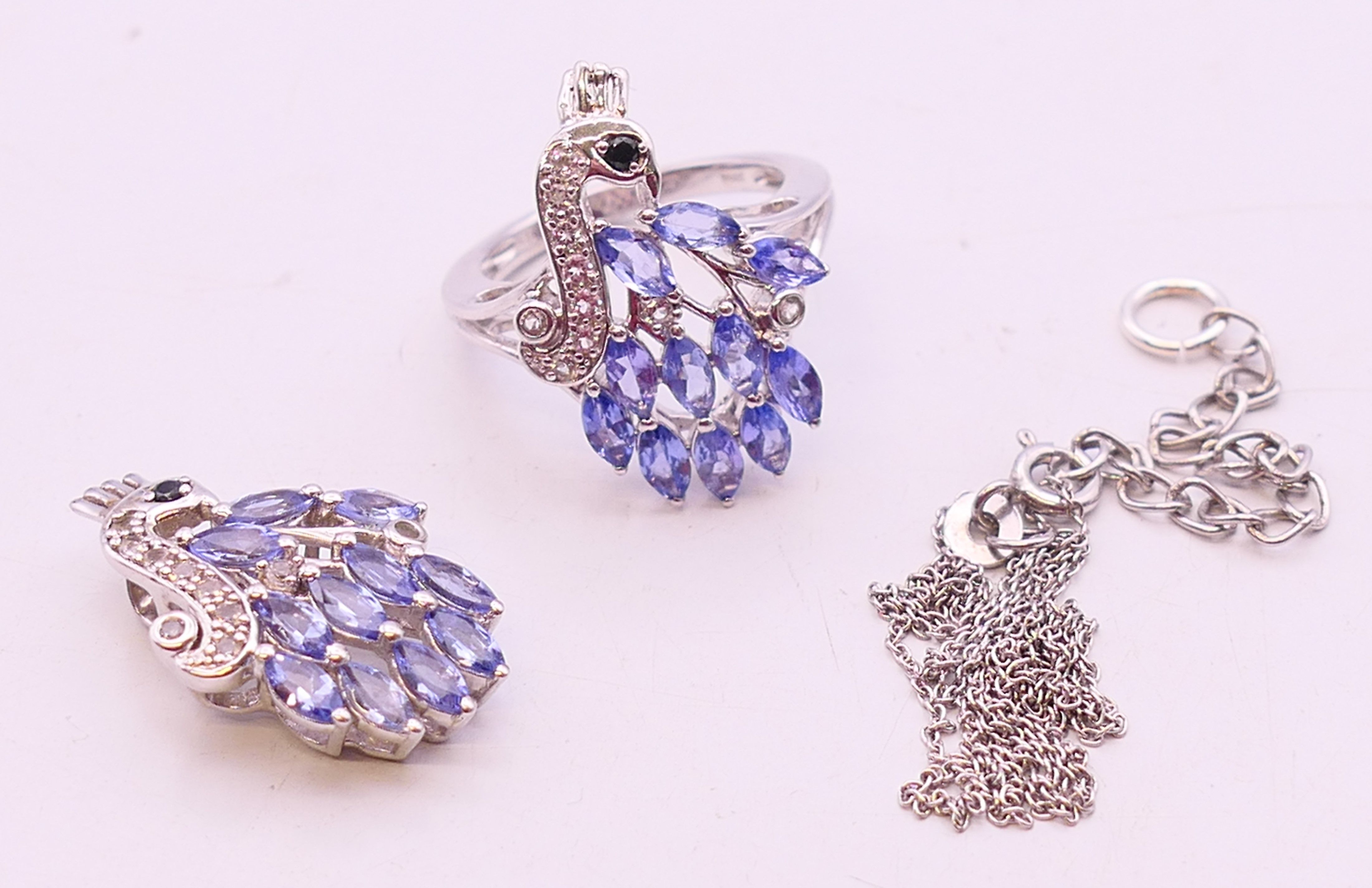 A tanzanite set pendant on chain and a ring. ring size N.