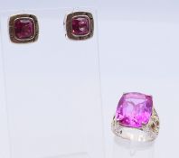 A silver and 18 ct gold mounted ring and a pair of silver earrings, each set with a pink stone,